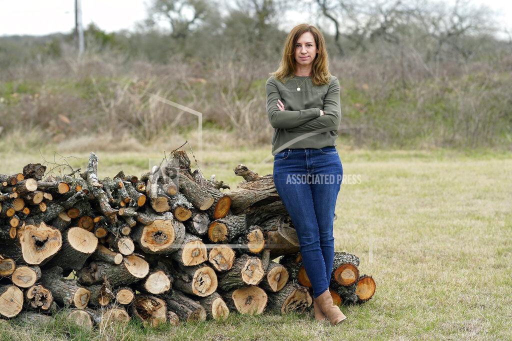 Eric Gay Rachel Van Lear poses for a portrait at her home in Buda, Texas, Tuesday, March 9, 2021. On the same day a global pandemic was declared, she developed symptoms of COVID-19. A year later, she’s still waiting for them to disappear. And for experts to come up with some answers. (AP Photo/Eric Gay)