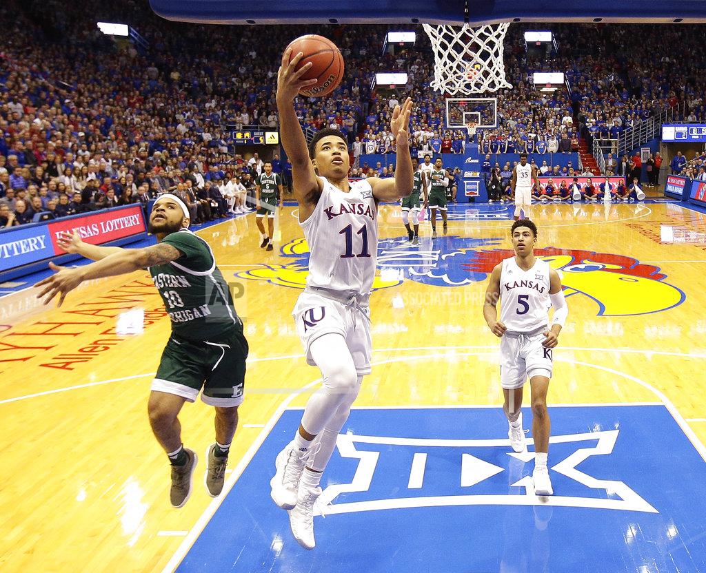 Charlie Riedel Kansas' Devon Dotson (11) gets past Eastern Michigan's Malik Ellison (10) to put up a shot during the first half of an NCAA college basketball game Saturday, Dec. 29, 2018, in Lawrence, Kan. (AP Photo/Charlie Riedel)