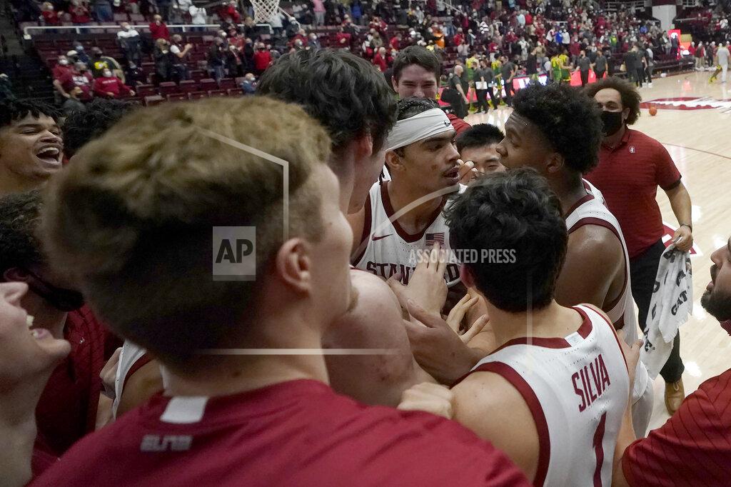Jeff Chiu Stanford forward Jaiden Delaire, middle facing, celebrates with teammates after Stanford defeated Oregon in an NCAA college basketball game in Stanford, Calif., Sunday, Dec. 12, 2021. (AP Photo/Jeff Chiu)