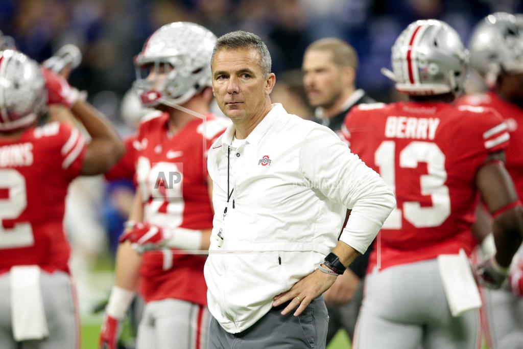 Aj Mast Ohio State head coach Urban Meyer watches during his team warm up before the Big Ten championship NCAA college football game against Northwestern, Saturday, Dec. 1, 2018, in Indianapolis. (AP Photo/AJ Mast)