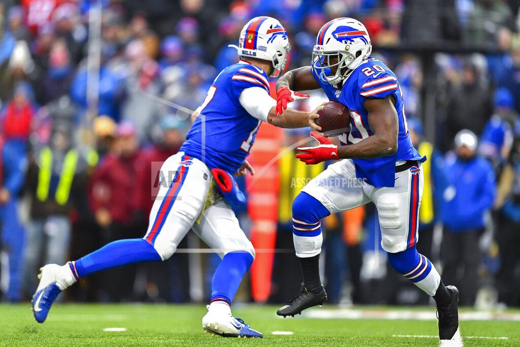 Adrian Kraus Buffalo Bills quarterback Josh Allen (17) hands off the ball to running back Frank Gore (20) during the third quarter of an NFL football game against the Denver Broncos, Sunday, Nov. 24, 2019, in Orchard Park, N.Y. (AP Photo/Adrian Kraus)