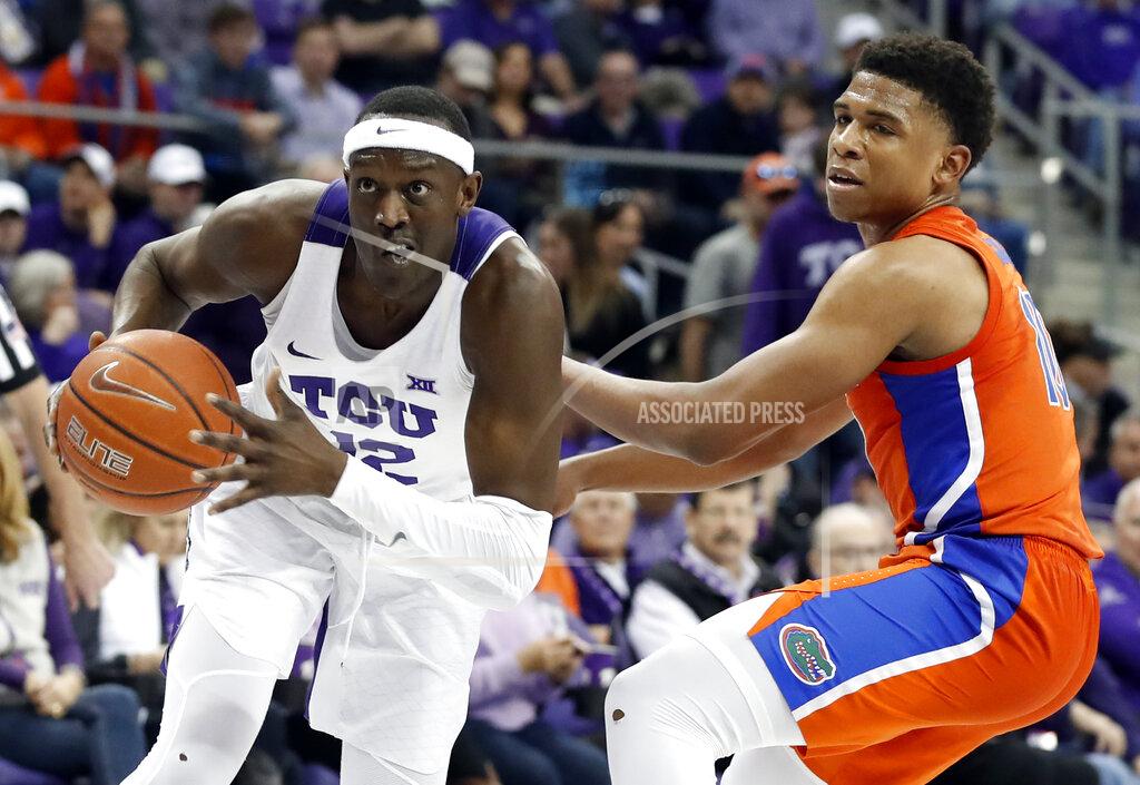 Tony Gutierrez TCU forward Kouat Noi (12), of Australia, drives to the basket past Florida guard Noah Locke (10) in the second half of an NCAA college basketball game in Fort Worth, Texas, Saturday, Jan. 26, 2019. (AP Photo/Tony Gutierrez)