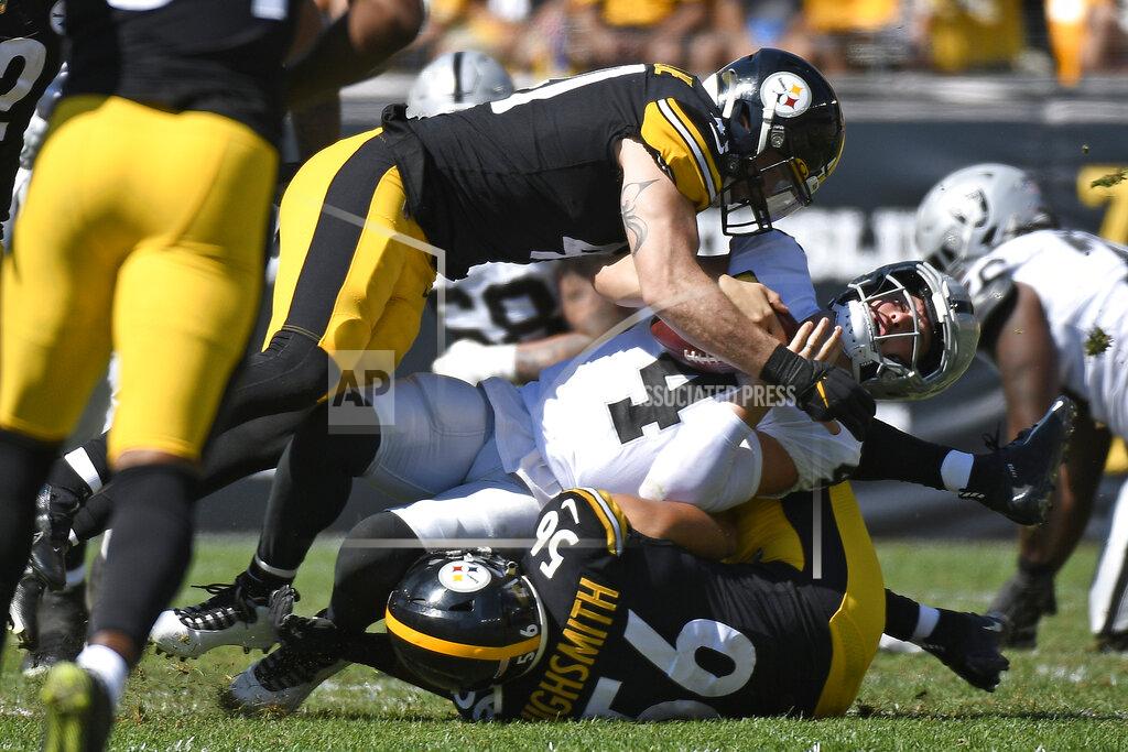 Don Wright Las Vegas Raiders quarterback Derek Carr (4) is sacked by Pittsburgh Steelers linebacker Robert Spillane, top, and linebacker Alex Highsmith (56) during the first half of an NFL football game in Pittsburgh, Sunday, Sept. 19, 2021. (AP Photo/Don Wright)