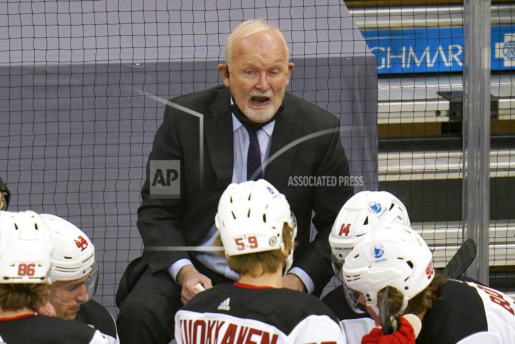 Gene J. Puskar New Jersey Devils coach Lindy Ruff gives instructions during the first period of the team's NHL hockey game against the Pittsburgh Penguins in Pittsburgh, Thursday, April 22, 2021. (AP Photo/Gene J. Puskar)