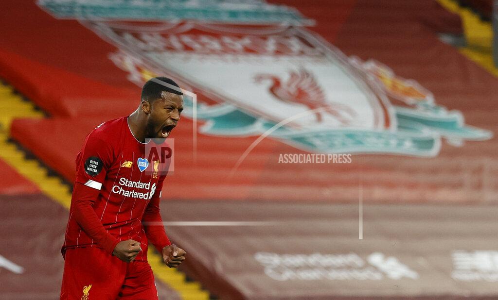 Phil Noble Liverpool's Georginio Wijnaldum, right turns and celebrates after scoring his sides 3rd goal during the English Premier League soccer match between Liverpool and Chelsea at Anfield Stadium in Liverpool, England, Wednesday, July 22, 2020. (Phil Noble/Pool via AP)