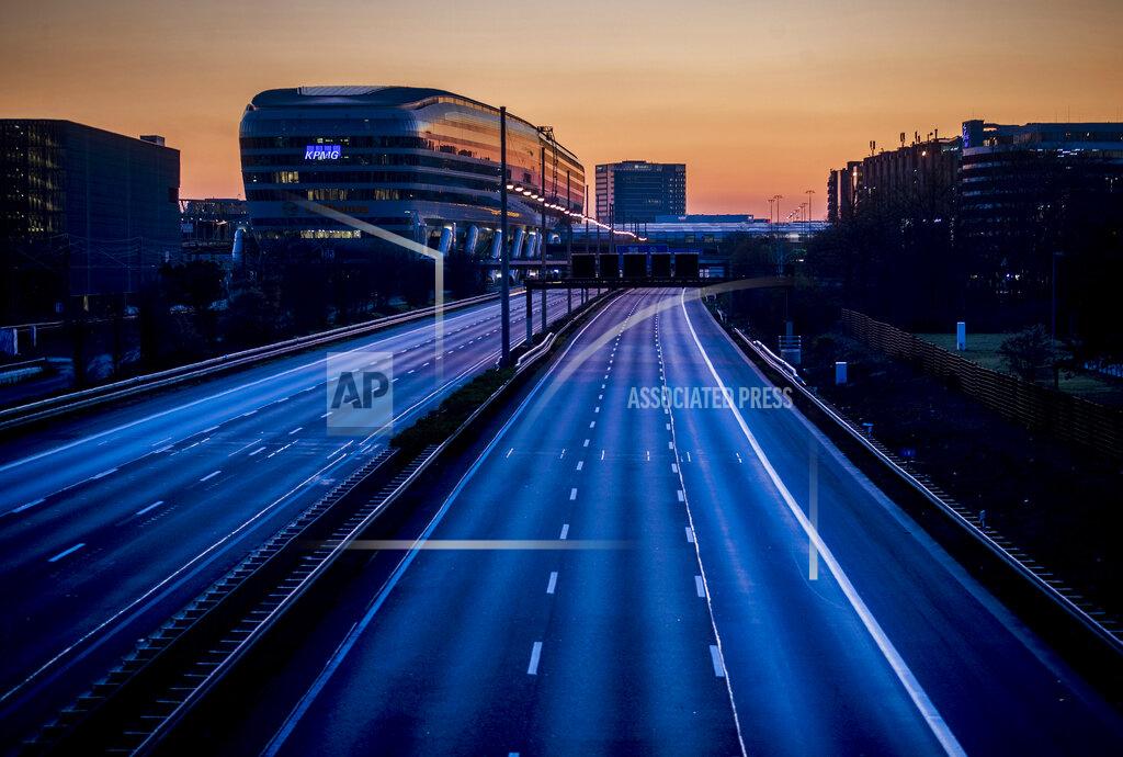 Michael Probst FILE - In this Sunday, March 22, 2020 file photo, the autobahn along the airport is deserted when the first nationwide restrictions came in place in Germany to avoid the spread of the corona virus. More than 50,000 people have died after contracting COVID-19 in Germany, a number that has risen swiftly over recent weeks as the country has struggled to bring down infection figures. (AP Photo/Michael Probst, file)