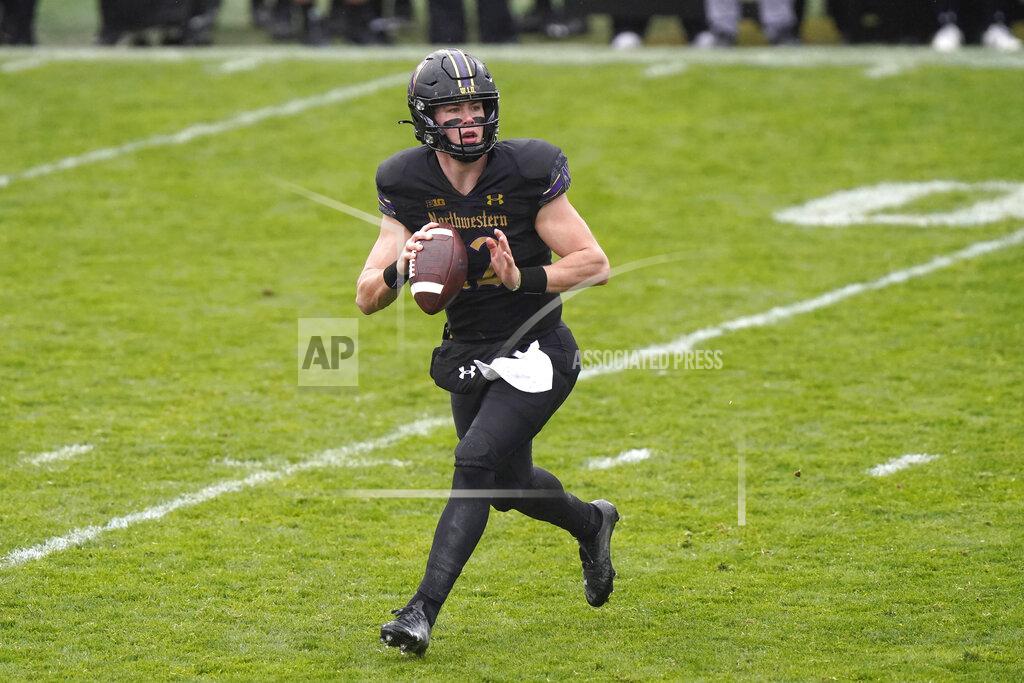Nam Y. Huh Northwestern quarterback Peyton Ramsey looks to a throw pass during the first half of an NCAA college basketball game against Illinois in Evanston, Ill., Saturday, Dec. 12, 2020. (AP Photo/Nam Y. Huh)