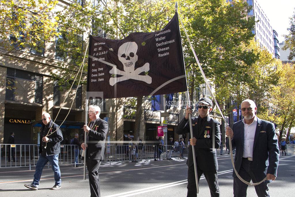 Mark Baker Veterans march during the Anzac Day parade in Sydney, Australia, Sunday, April 25, 2021. Australians and New Zealanders paid tribute to their war dead Sunday as both nations prepared to withdraw from their longest war in Afghanistan. (AP Photo/Mark Baker)