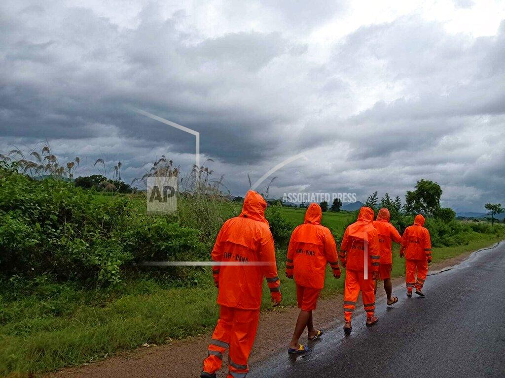Uncredited This Photograph provided by India's National Disaster Response Force (NDRF) shows NDRF personnel arriving in preparation for Cyclone Gulab, that likely to make landfall on Sunday evening at Ganjam, eastern Odisha state, India, Sunday, Sept.26, 2021. (National Disaster Response Force via AP)