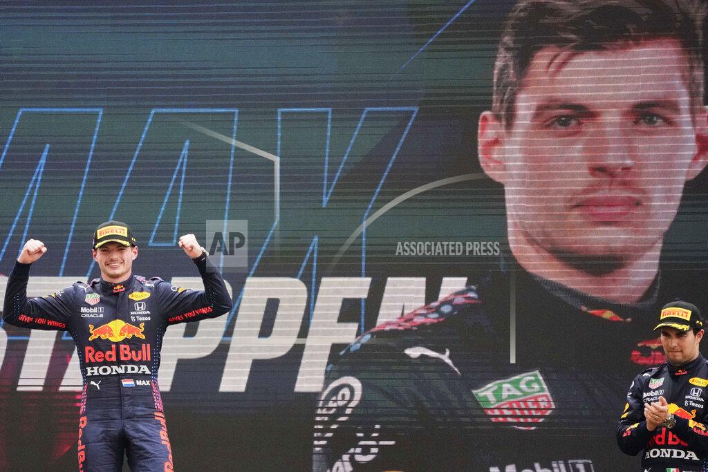Francois Mori Red Bull driver Max Verstappen of the Netherlands celebrates from the podium after winning during the French Formula One Grand Prix at the Paul Ricard racetrack in Le Castellet, southern France, Sunday, June 20, 2021. (AP Photo/Francois Mori)