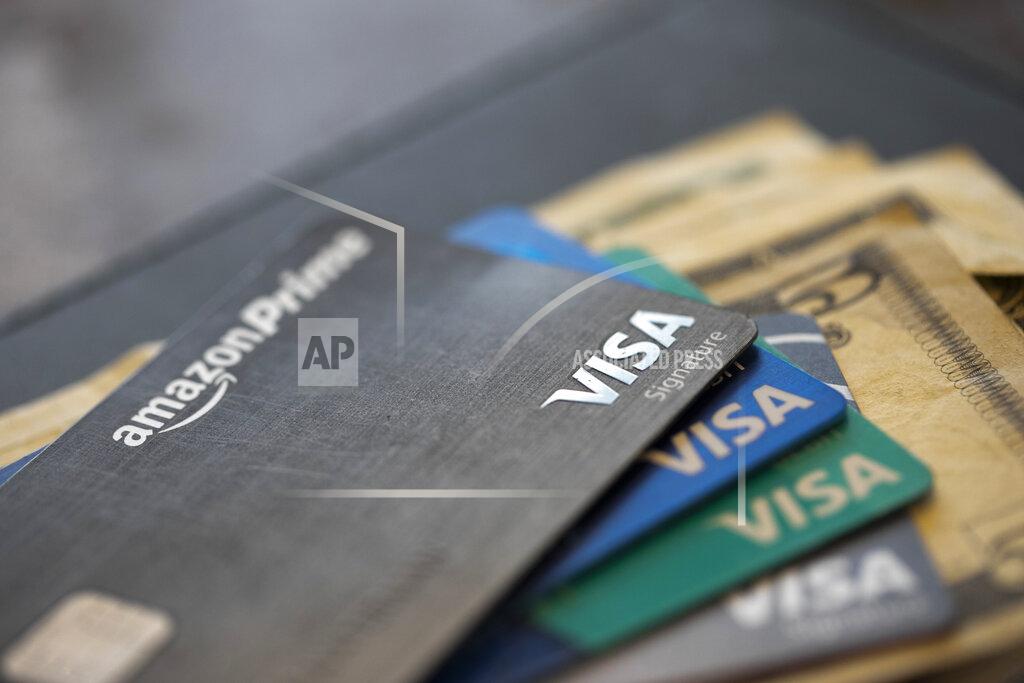 This Aug. 11, 2019 file photo shows credit cards in New Orleans. U.S. consumer borrowing plunged in April as households fretted about the disruptions caused by the coronavirus pandemic and cut back on their use of credit. The Federal Reserve reported Friday, June 5, 2020 that total borrowing fell by $68.8 billion, or 19.6%. That was the biggest one-month decline in percentage terms since the end of World War II. (AP Photo/Jenny Kane, file)
