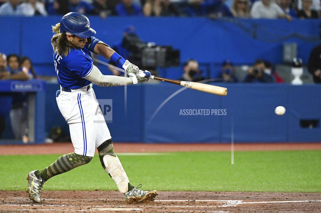 Jon Blacker Toronto Blue Jays' Bo Bichette hits an RBI double against the Cincinnati Reds during the fifth inning of a baseball game Friday, May 20, 2022, in Toronto. (Jon Blacker/The Canadian Press via AP)