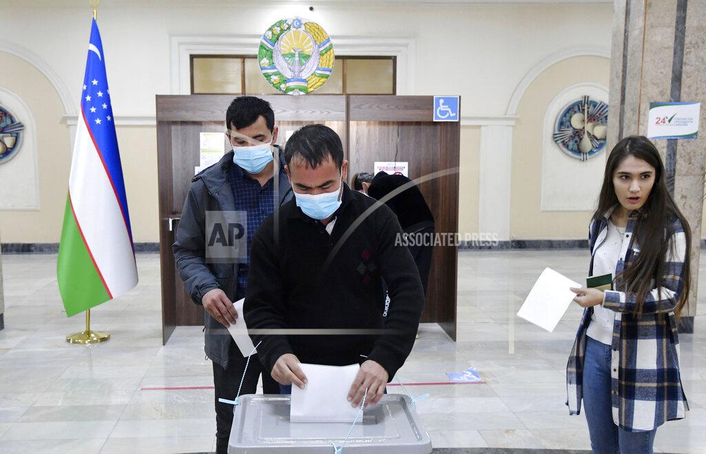 Uncredited A man casts his ballot at a polling station during the presidential election in Tashkent, Uzbekistan, Sunday, Oct. 24, 2021. Uzbeks voted Sunday in a presidential election that the incumbent is expected to win in a landslide against weak competition. Although Shavkat Mirziyoyev has relaxed many of the policies of his dictatorial predecessor, he has made little effort at political reform. He took office in 2016 upon the death of Islam Karimov and faces four relatively low-visibility candidates who did not even show up for televised debates. (AP Photo)