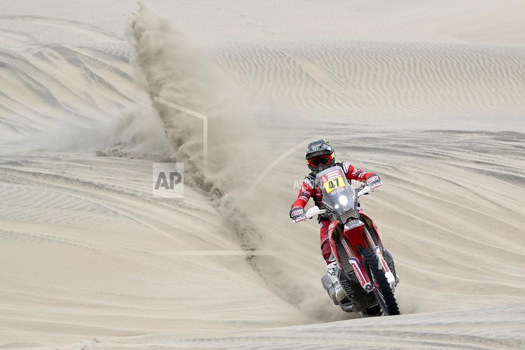 Ricardo Mazalan Kevin Benavides of Argentina rides his Honda motorbike across the dunes during the second stage of the Dakar Rally between Pisco and San Juan de Marcona, Peru, Tuesday, Jan. 8, 2019. (AP Photo/Ricardo Mazalan)