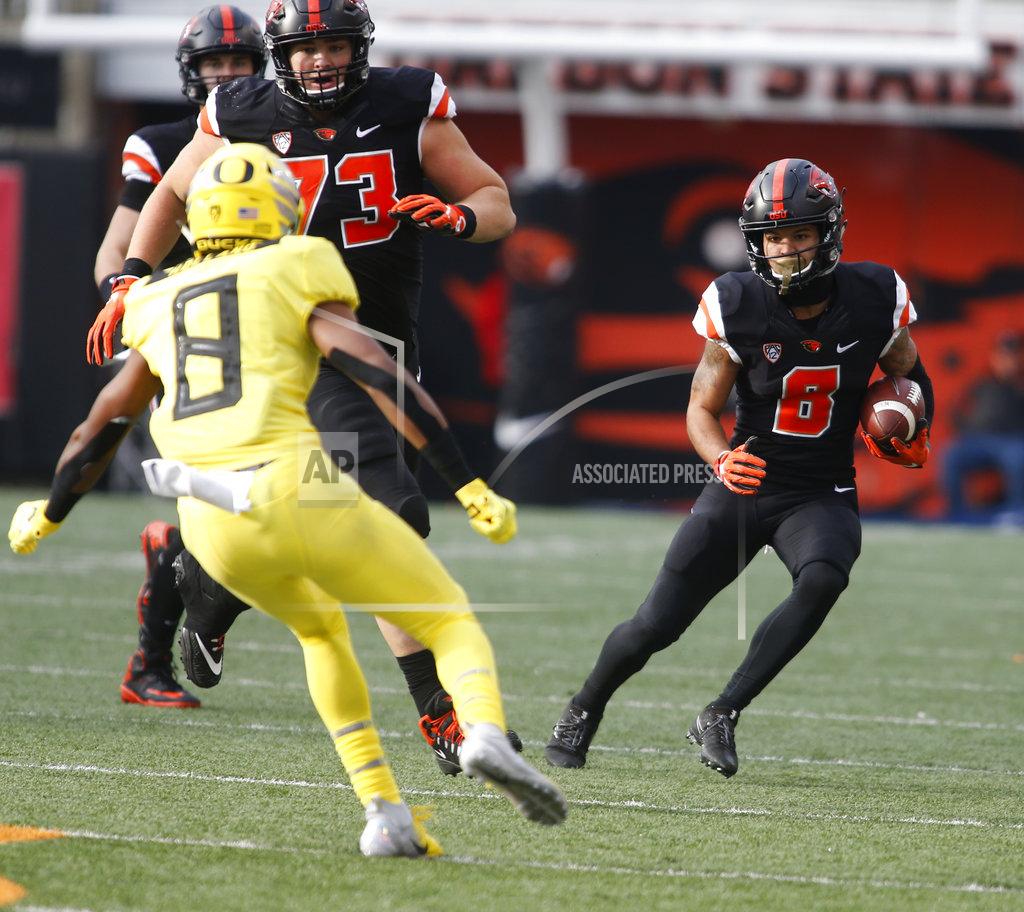 Timothy J. Gonzalez Oregon State wide receiver Trevon Bradford (8) tries to get past Oregon safety Jevon Holland (8) in the first half of an NCAA college football game in Corvallis, Ore., on Friday, Nov. 23, 2018. (AP Photo/Timothy J. Gonzalez)