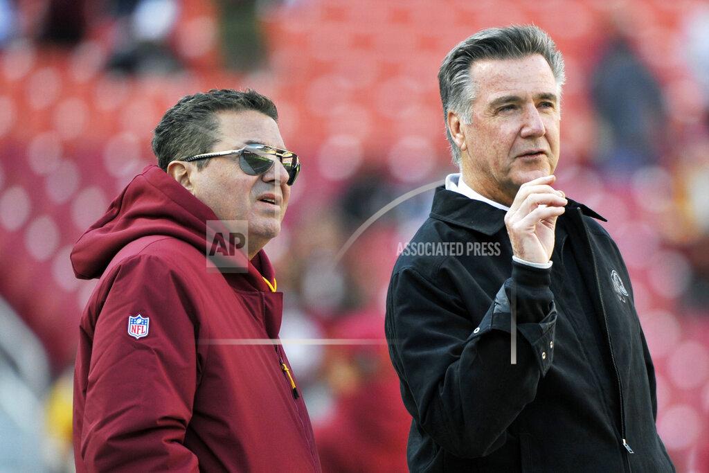 Mark Tenally FILE - In this Oct. 21, 2018 file photo, Washington Redskins owner Dan Snyder, left, and team president Bruce Allen talk on the field prior to an NFL football game between the Dallas Cowboys and Washington Redskins, in Landover, Md. Allen was fired Monday, Dec. 30, 2019, after a tumultuous and loss-filled decade with the NFL team once coached by his father. (AP Photo/Mark Tenally, File)