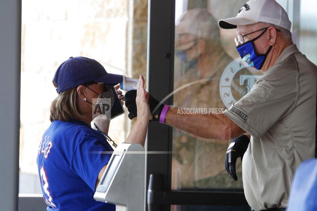 Lm Otero Amid concerns of the spread of the virus that causes COVID-19, a baseball fan has their temperature checked by a security guard before being allowed to tour Globe Life Field, home of the Texas Rangers baseball team in Arlington, Texas, Monday, June 1, 2020. The coronavirus pandemic has forced sports teams and their leagues to evaluate how they will welcome back fans. (AP Photo/LM Otero)