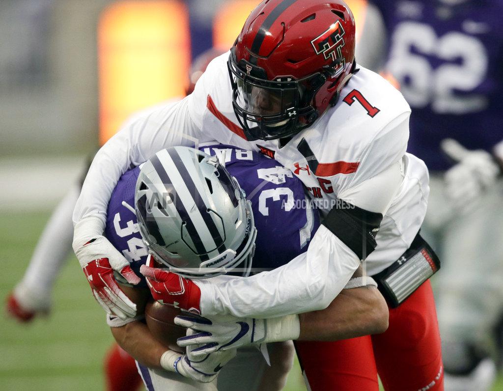 Orlin Wagner Kansas State running back Alex Barnes (34) is tackled by Texas Tech defensive back Jah'Shawn Johnson (7) during the first half of an NCAA college football game in Manhattan, Kan., Saturday, Nov. 17, 2018. (AP Photo/Orlin Wagner)