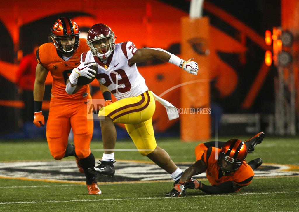 Timothy J. Gonzalez Southern California's Vavae Malepeai (29) pulls out of the tackle attempt by Oregon State's Dwayne Williams, right, in the second half of an NCAA college football game in Corvallis, Ore., on Saturday, Nov. 3, 2018. Southern California won 38-21. (AP Photo/Timothy J. Gonzalez)