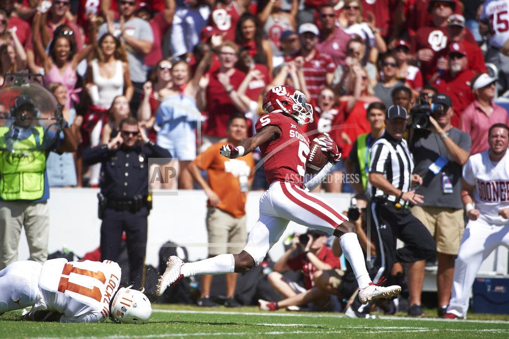 Cooper Neill Oklahoma wide receiver Marquise Brown (5) breaks free for a 77-yard touchdown reception against Texas during the second half of an NCAA college football game at the Cotton Bowl, Saturday, Oct. 6, 2018, in Dallas. (AP Photo/Cooper Neill)