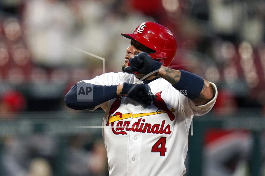 Jeff Roberson St. Louis Cardinals' Yadier Molina celebrates as he arrives home after hitting a solo home run during the second inning of a baseball game against the Cincinnati Reds Friday, April 23, 2021, in St. Louis. (AP Photo/Jeff Roberson)