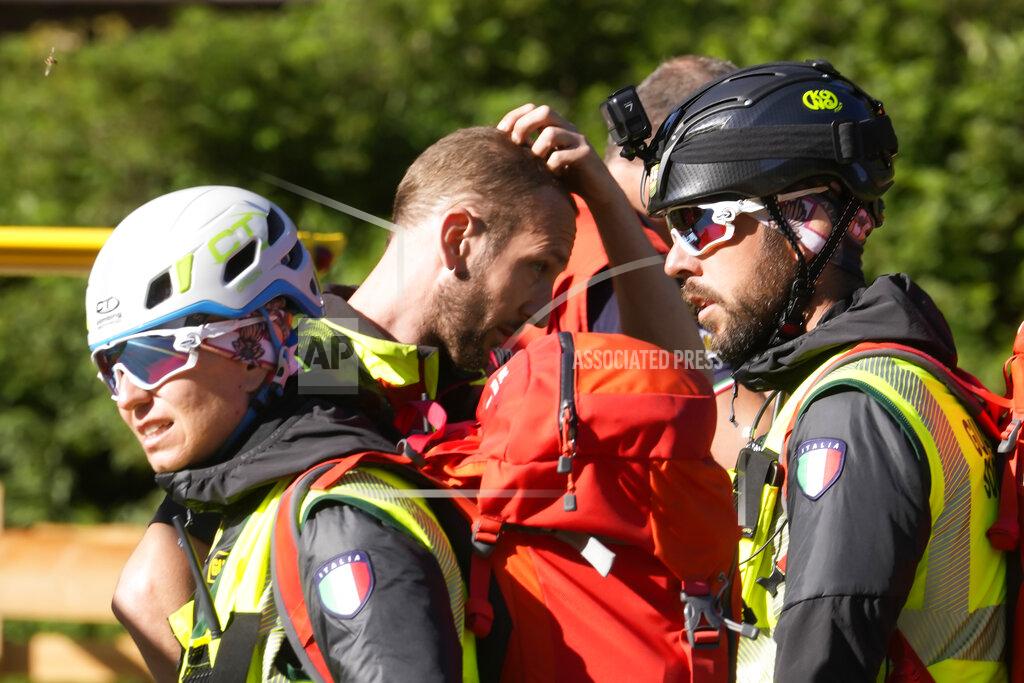 Luca Bruno Rescuers prepare to conduct searches for the victims of the Punta Rocca glacier avalanche in Canazei, in the Italian Alps in northern Italy, Tuesday, July 5, 2022, two day after a huge chunk of the glacier broke loose, sending an avalanche of ice, snow, and rocks onto hikers. (AP Photo/Luca Bruno)