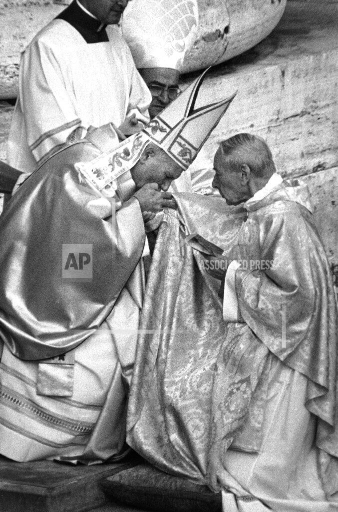 Uncredited FILE - In this Oct. 22, 1978 file photo, Pope John Paul II kisses the hand of Polish Cardinal Stefan Wyszynski in Vatican City, when the successor of late Pope John Paul I was officially installed as the new Pontiff, and cardinals paid obedience to the Pope. Poland's top political leaders gathered in a Warsaw church Sunday, Sept. 12, 2021 for the beatification of two revered figures of the Catholic church — a cardinal who led the Polish church's resistance to communism and a blind nun who devoted her life to helping others who couldn't see. (AP Photo, File)