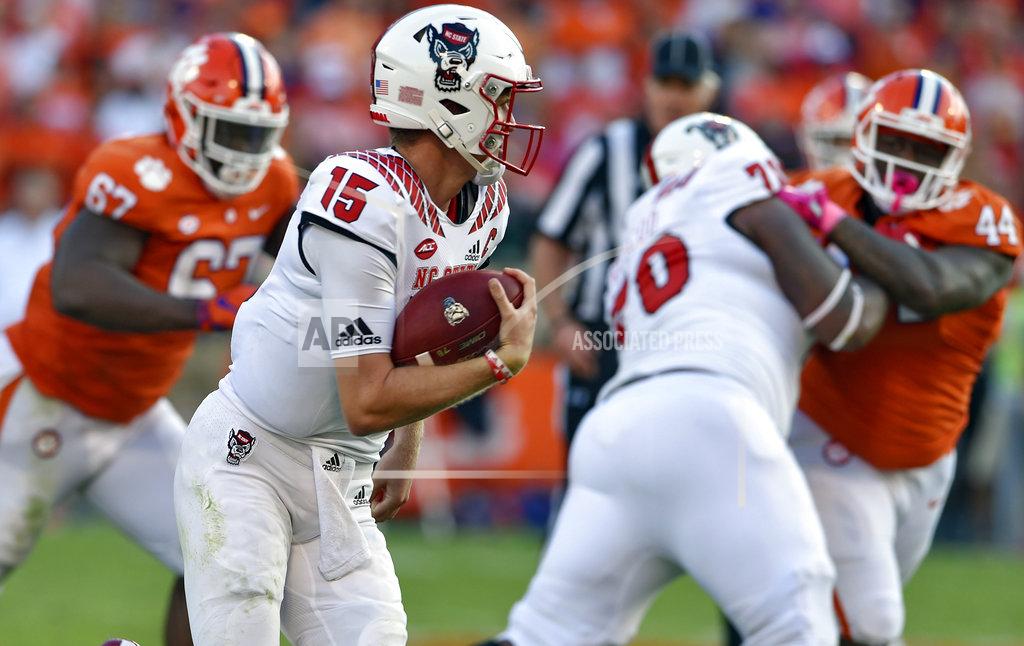 Richard Shiro North Carolina State quarterback Ryan Finley scrambles out of the pocket during the second half of an NCAA college football game against Clemson Saturday, Oct. 20, 2018, in Clemson, S.C. (AP Photo/Richard Shiro)