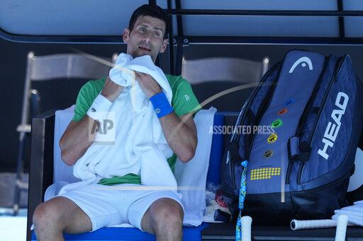 Defending men's champion Serbia's Novak Djokovic rests during a practice session on Margaret Court Arena ahead of the Australian Open tennis championship in Melbourne, Australia, Thursday, Jan. 13, 2022. AP Photo/Mark Baker)