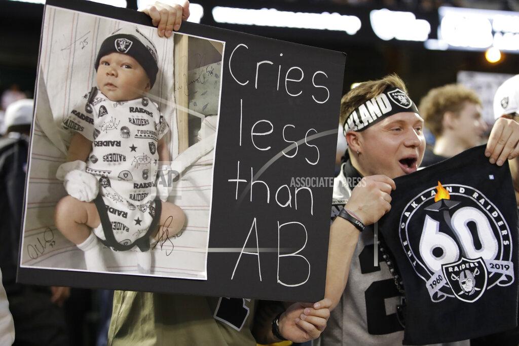 Ben Margot An Oakland Raiders cheers during the first half of an NFL football game against the Denver Broncos Monday, Sept. 9, 2019, in Oakland, Calif. (AP Photo/Ben Margot)