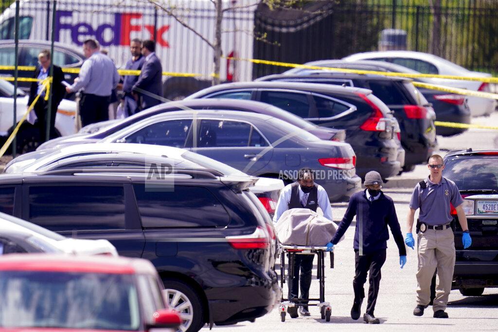 Michael Conroy A body is taken from the scene where multiple people were shot at a FedEx Ground facility in Indianapolis, Friday, April 16, 2021. A gunman killed several people and wounded others before taking his own life in a late-night attack at a FedEx facility near the Indianapolis airport, police said. (AP Photo/Michael Conroy)