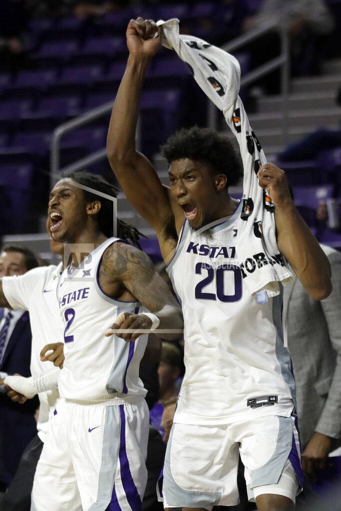 Orlin Wagner Kansas State guard Cartier Diarra (2) and forward Xavier Sneed (20) celebrate a 3-point basket while on the bench during the second half of the team's NCAA college basketball game against Monmouth in Manhattan, Kan., Wednesday, Nov. 13, 2019. Kansas State defeated Monmouth 73-54. (AP Photo/Orlin Wagner)