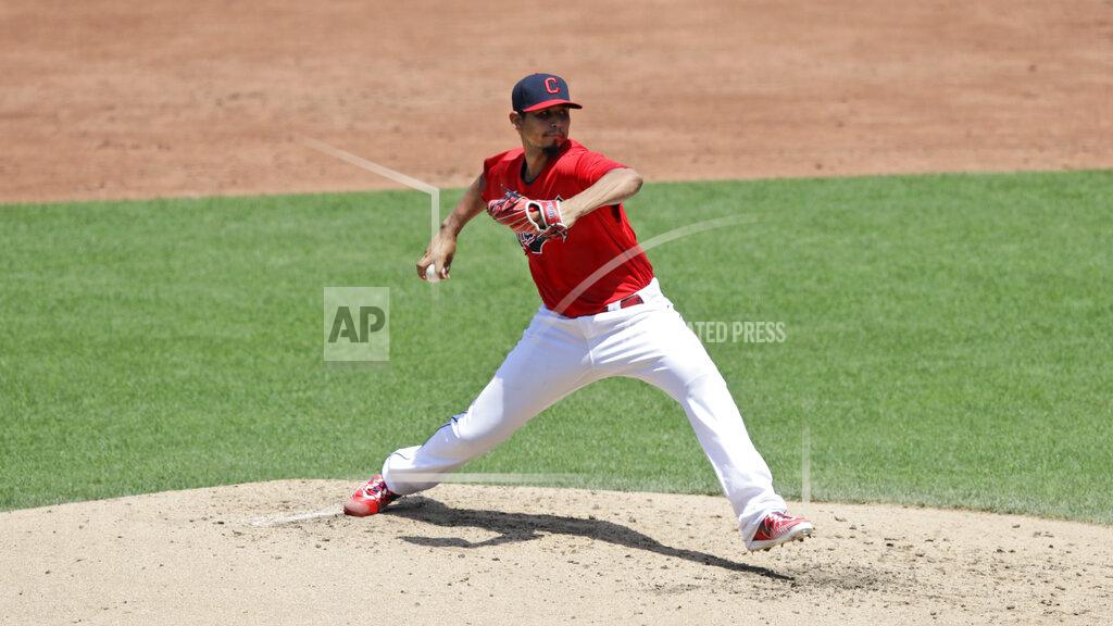 Tony Dejak Cleveland Indians starting pitcher Carlos Carrasco delivers in the third inning in a baseball game against the Kansas City Royals, Sunday, July 26, 2020, in Cleveland. (AP Photo/Tony Dejak)