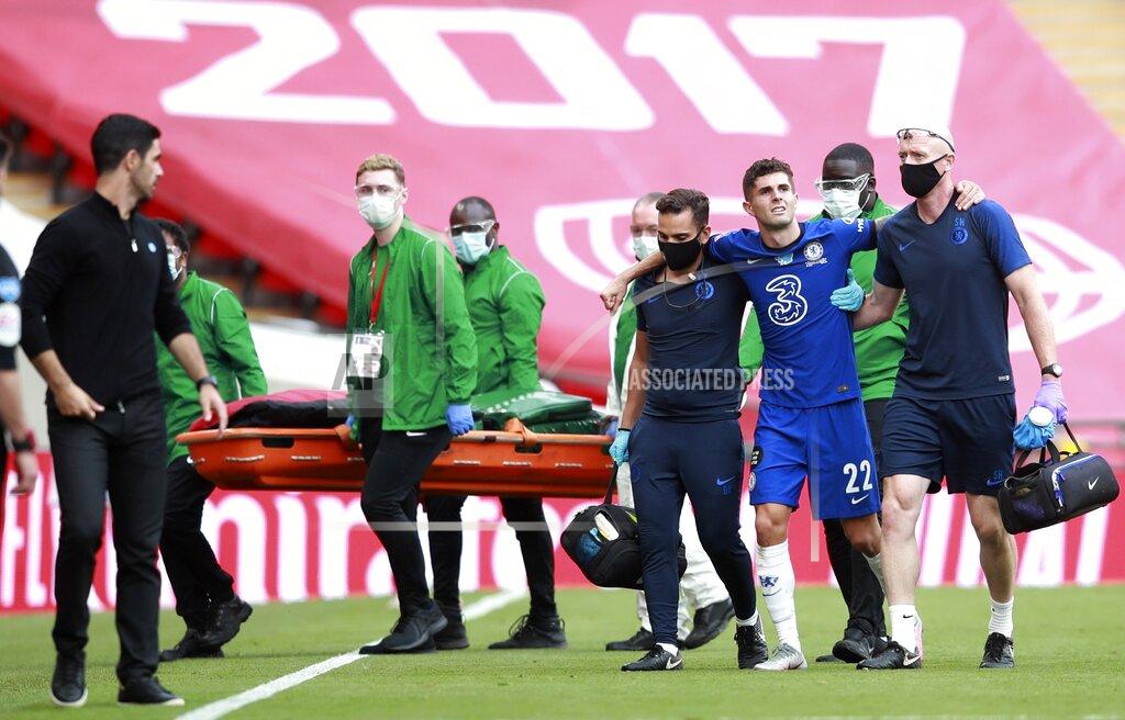 Adam Davy Chelsea's Christian Pulisic is assisted from the field after getting injured during the FA Cup final soccer match between Arsenal and Chelsea at Wembley stadium in London, England, Saturday, Aug. 1, 2020. (Adam Davy/Pool via AP)