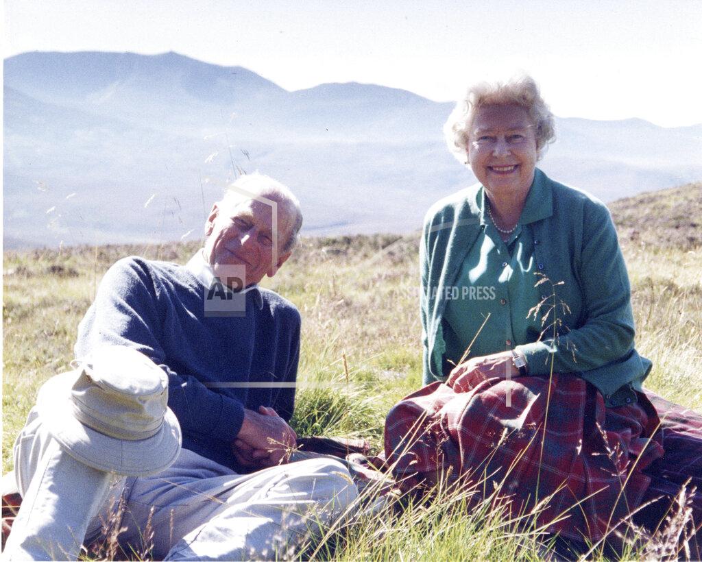 The Countess Of Wessex In this 2003 photo released by Buckingham Palace Friday April 16, 2021, a personal photograph of Queen Elizabeth II and Prince Philip Duke of Edinburgh at the top of the Coyles of Muick, Scotland, in this photo taken by Sophie The Countess of Wessex in 2003. (The Countess of Wessex/Buckingham Palace via AP)