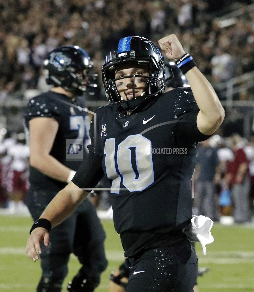 John Raoux Central Florida quarterback McKenzie Milton celebrates after his 1-yard touchdown run against Temple during the first half of an NCAA college football game, Thursday, Nov. 1, 2018, in Orlando, Fla. (AP Photo/John Raoux)