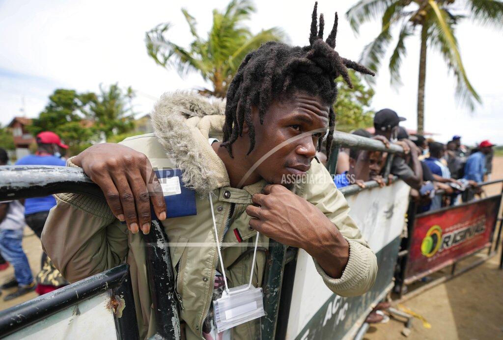 Fernando Vergara Haitian migrants wait to board a boat that will take them to Acandi, a town near the border with Panama, before they depart from Necocli, Colombia, Monday, Sept. 13, 2021. Migrants have been gathering in Necocli as they move north on their way to the U.S. border. (AP Photo/Fernando Vergara)