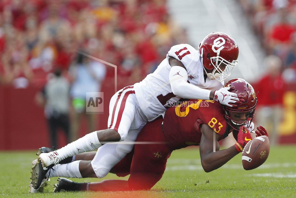Matthew Putney FILE - In this Sept. 15, 2018, file photo, Oklahoma cornerback Parnell Motley, top, breaks up a pass intended for Iowa State wide receiver Jalen Martin, right, during the first half of an NCAA college football game, in Ames, Iowa. Last season gave Iowa State hope that its decades of irrelevance might soon be over. This season has been a painful reminder that the path to national relevance isn’t always linear. (AP Photo/Matthew Putney, File)