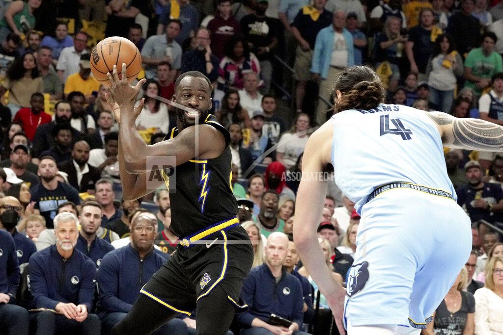 Karen Pulfer Focht Golden State Warriors' Draymond Green (23) looks to pass as Memphis Grizzlies' Steven Adams (4) moves in during the first half of Game 5 of an NBA basketball second-round playoff series Wednesday, May 11, 2022, in Memphis, Tenn. (AP Photo/Karen Pulfer Focht)
