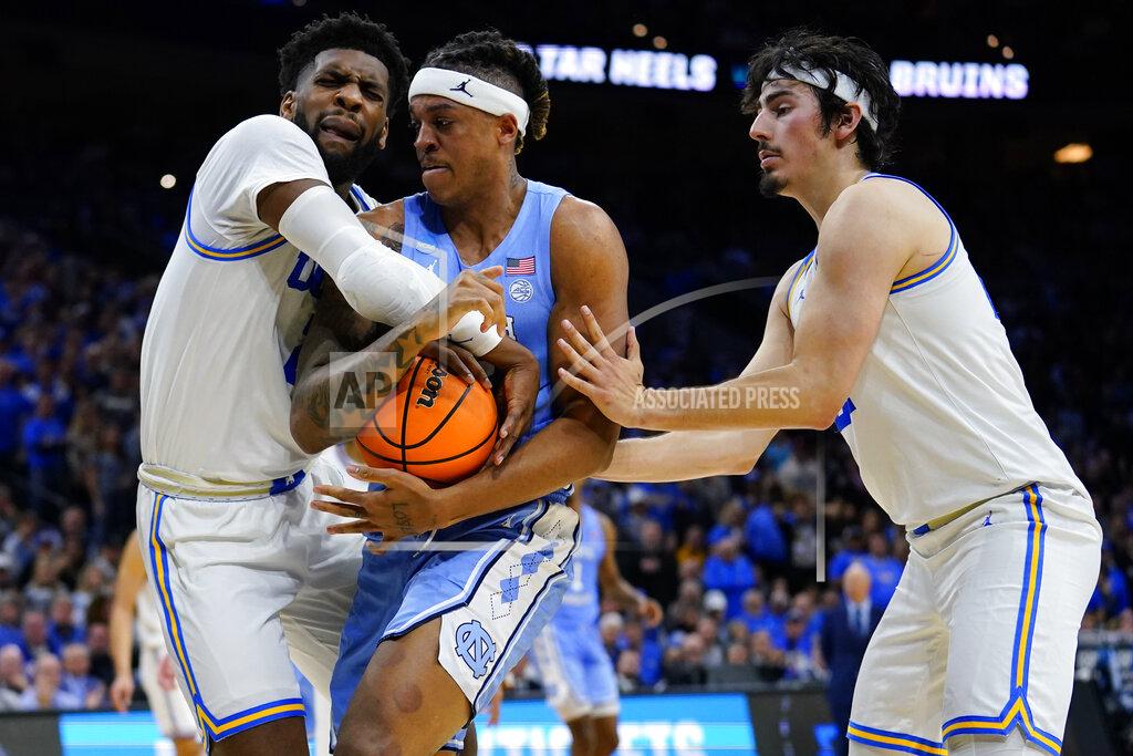 Matt Rourke North Carolina's Armando Bacot, center, battle for the ball with UCLA's Cody Riley, left, and Jaime Jaquez Jr. during the second half of a college basketball game in the Sweet 16 round of the NCAA tournament, Friday, March 25, 2022, in Philadelphia. (AP Photo/Matt Rourke)
