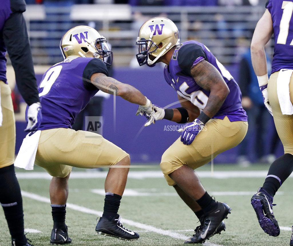 Elaine Thompson Washington's Myles Gaskin, left, congratulates Salvon Ahmed on Ahmed's touchdown run against Oregon State in the first half of an NCAA college football game Saturday, Nov. 17, 2018, in Seattle. (AP Photo/Elaine Thompson)