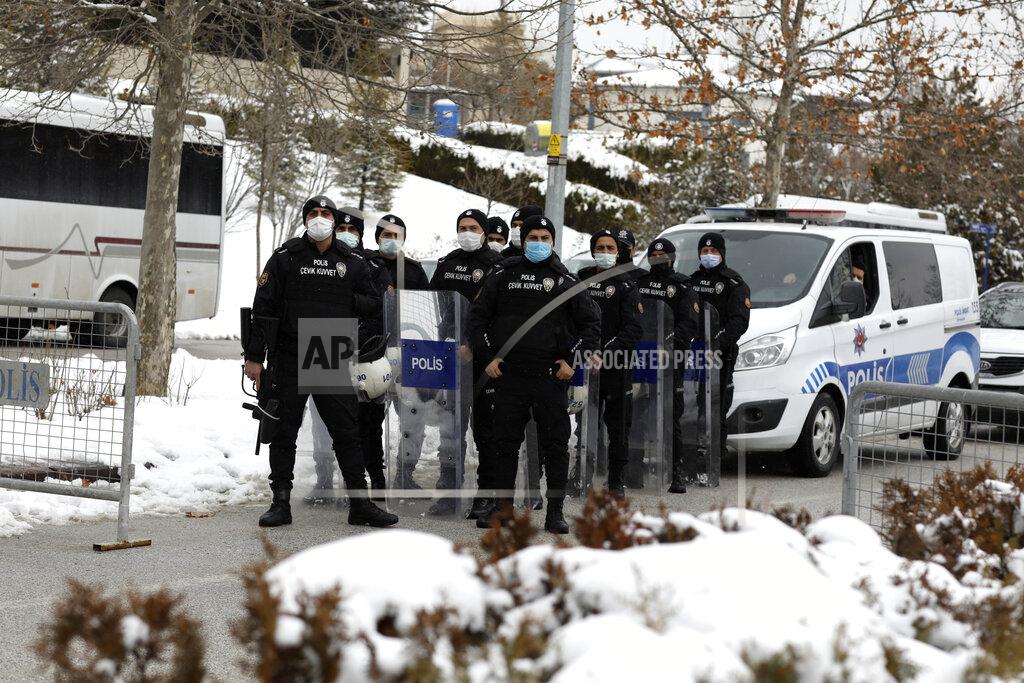 Burhan Ozbilici Turkish police officers block a road leading to the Chinese embassy as Uyghurs stage a protest nearby, in Ankara, Turkey, Thursday, March 25, 2021. Hundreds of Uyghurs staged protests in Ankara and Istanbul on Thursday, denouncing Chinese Foreign Minister Wang Yi's visit to Turkey and demanding that the Turkish government take a stronger stance against human rights abuses in China's far-western Xinjiang region. (AP Photo/Burhan Ozbilici)