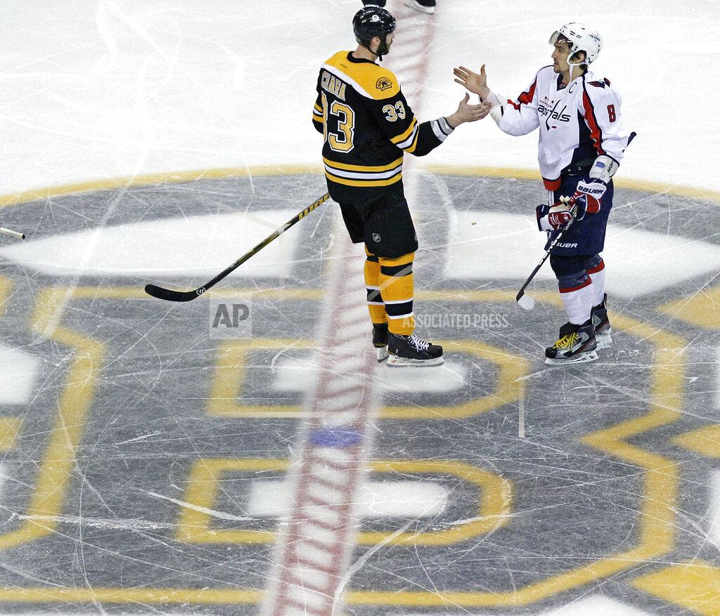 Charles Krupa FILE - Boston Bruins defenseman Zdeno Chara (33) congratulates Washington Capitals left wing Alex Ovechkin (8) after the Capitals' 2-1 overtime win in Game 7 of an NHL hockey Stanley Cup first-round playoff series, in Boston, in this Wednesday, April 25, 2012, file photo. Alex Ovechkin goes into the final year of his contract with the Washington Capitals looking to win the Stanley Cup for the second time. He’ll have 43-year-old past champion Zdeno Chara with him but not Henrik Lundqvist chasing his first title, after tests showed the veteran goaltender couldn’t keep playing because of a heart condition. (AP Photo/Charles Krupa, File)