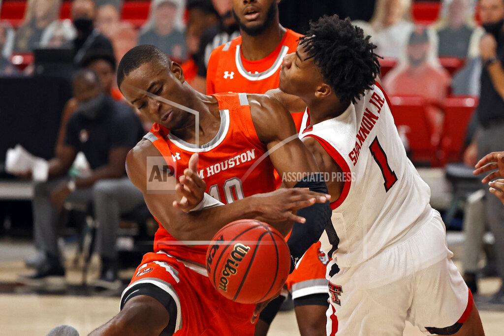 Brad Tollefson Sam Houston State's Zach Nutall (10) and Texas Tech's Terrence Shannon Jr. (1) try to rebound the ball during the first half of an NCAA college basketball game Friday, Nov. 27, 2020, in Lubbock, Texas. (AP Photo/Brad Tollefson)