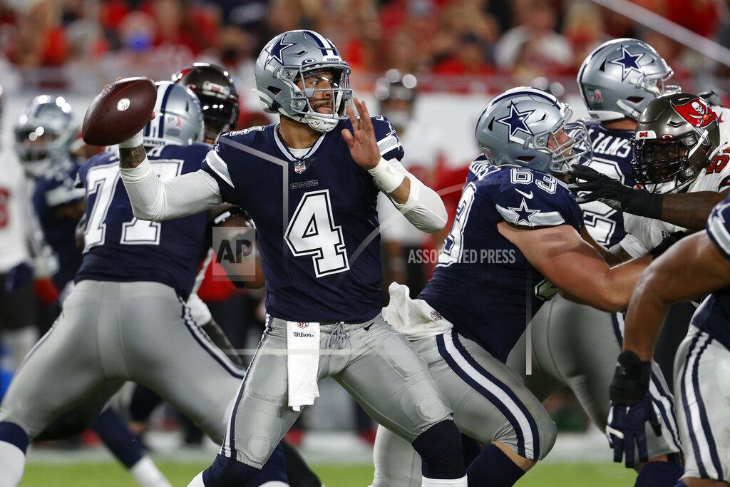 Dallas Cowboys quarterback Dak Prescott (4) throws a pass against the Tampa Bay Buccaneers during the first half of an NFL football game Thursday, Sept. 9, 2021, in Tampa, Fla. (AP Photo/Scott Audette)