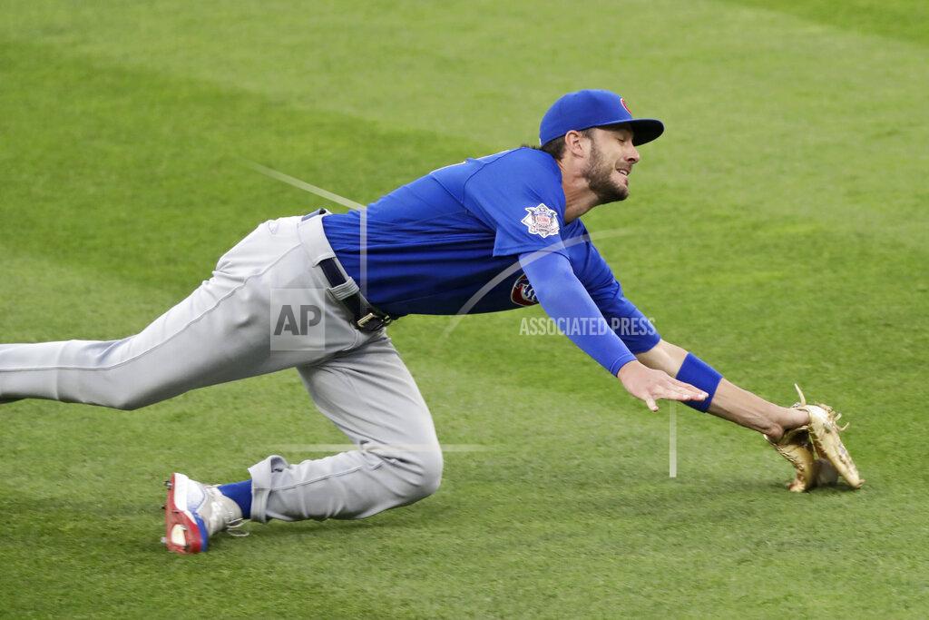 Tony Dejak Chicago Cubs' Kris Bryant can't make the catch on a ball hit by Cleveland Indians' Cesar Hernandez in the fifth inning in a baseball game, Wednesday, Aug. 12, 2020, in Cleveland. Hernandez was safe at first base. (AP Photo/Tony Dejak)