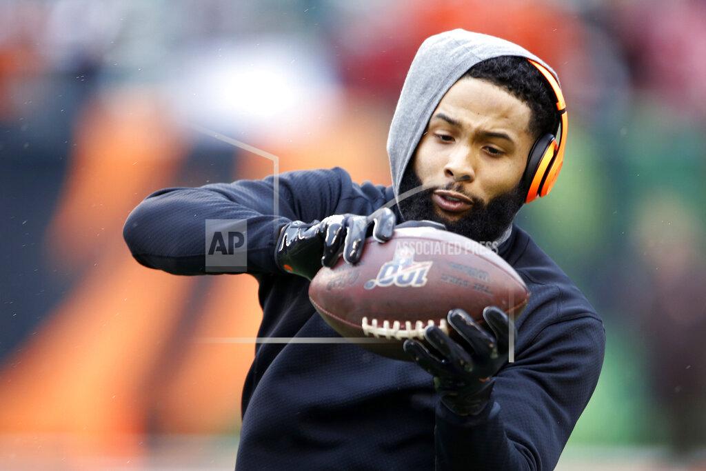 Gary Landers FILE - In this Dec. 29, 2019, file photo, Cleveland Browns wide receiver Odell Beckham Jr. catches a pass before an NFL football game against the Cincinnati Bengals in Cincinnati. Cleveland general manager Andrew Berry said Tuesday that Beckham has been fully committed to reporting to the team's facility. (AP Photo/Gary Landers, File)