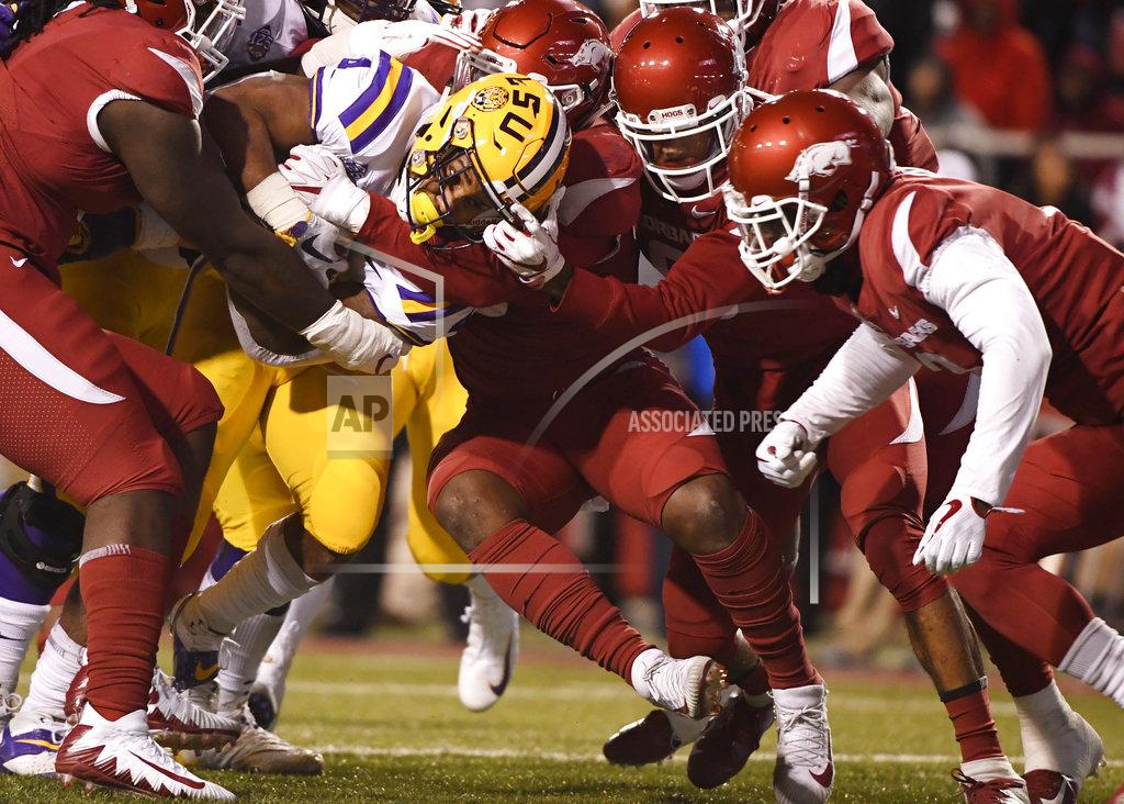 Michael Woods LSU running back Nick Brossette pushes through the Arkansas defense to score a touchdown during the first half of an NCAA college football game, Saturday, Nov. 10, 2018, in Fayetteville, Ark. (AP Photo/Michael Woods)