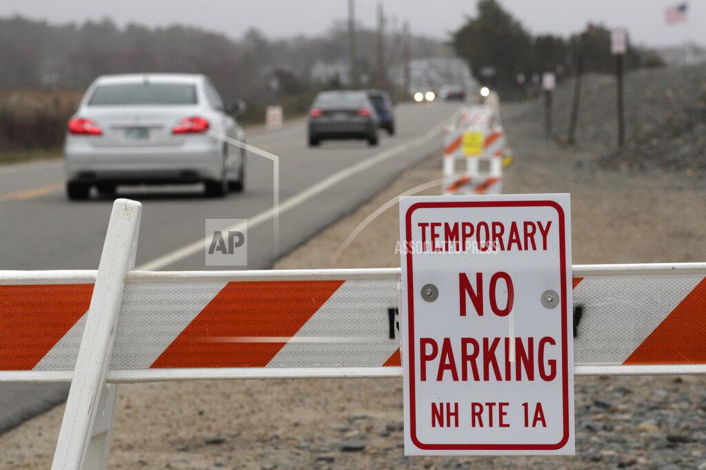 Charles Krupa Signs notify drivers that they are not allowed to park along side beaches which are closed, due to the COVID-19 virus outbreak, in Rye, N.H., Thursday, April 30, 2020. (AP Photo/Charles Krupa)