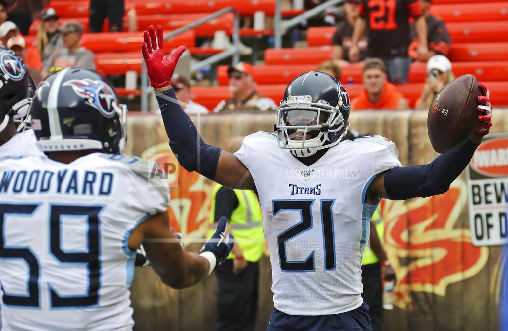 Ron Schwane Tennessee Titans cornerback Malcolm Butler (21) celebrates with teammates after Butler intercepted for a 38-yard touchdown during the second half in an NFL football game, Sunday, Sept. 8, 2019, in Cleveland. The Titans won 43-13. (AP Photo/Ron Schwane)